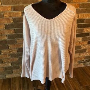 Size large beige stretchy tunic with back out and frayed edged bottom